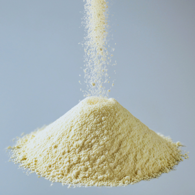 Vitamin being poured onto a pile on a blue background